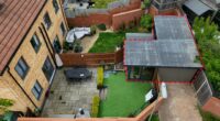 Couple locked in neighbour row ordered to tear down home gym as war over parking spaces erupts… they say ‘it’s not us’