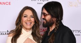 Elizabeth Hurley looks loved-up with boyfriend Billy Ray Cyrus as actress stuns in a plunging midi dress at The Royal Academy of Dance event