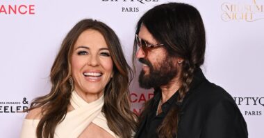 Elizabeth Hurley looks loved-up with boyfriend Billy Ray Cyrus as actress stuns in a plunging midi dress at The Royal Academy of Dance event