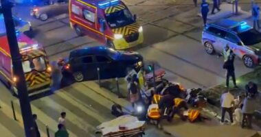 Four injured after car ploughs into crowd celebrating PSG Champions League win in Grenoble with woman fighting for life