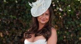 Glamorous revellers brave wet and windy weather as they arrive at Epsom Ladies' Day