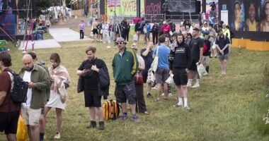 Glastonbury begins: Festivalgoers face rain, shower queues and hundreds of hippy crack canisters littering site after 'embarrassing sound issues' hit opening ceremony