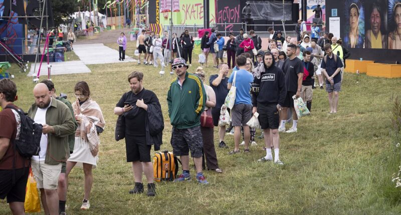 Glastonbury begins: Festivalgoers face rain, shower queues and hundreds of hippy crack canisters littering site after 'embarrassing sound issues' hit opening ceremony