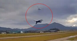 Harrowing moment plane comes terrifyingly close to helicopter as it takes off at airport