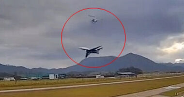 Harrowing moment plane comes terrifyingly close to helicopter as it takes off at airport