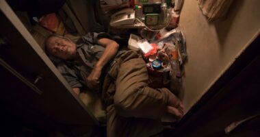 Hong Kong’s dystopian ‘coffin homes’ where 200,000 live in tiny boxes with barely enough space for a bed amid high rents