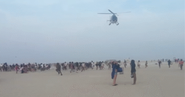 Hundreds of teenagers transform peaceful beach into chaos as police forced to break up fights