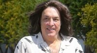 Iconic '80s lead singer who was born without an ear looks unrecognizable in rare outing... can you guess who?