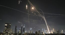 Iranian ballistic missiles rain down on Tel Aviv with skies ablaze after Iran vowed 'revenge' on Israel for nuclear site attacks