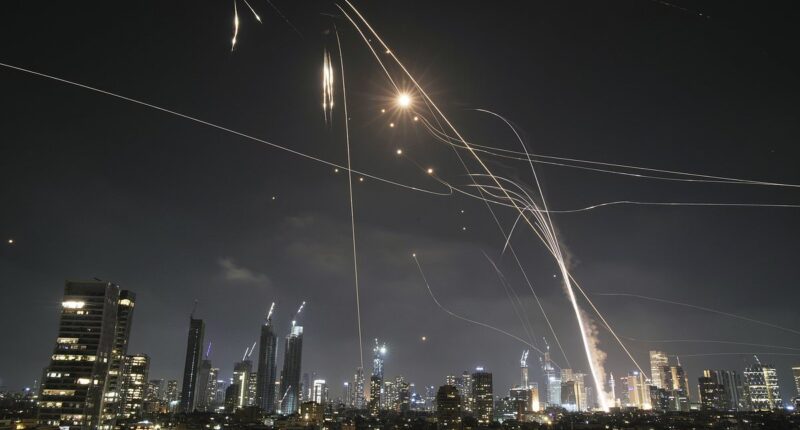 Iranian ballistic missiles rain down on Tel Aviv with skies ablaze after Iran vowed 'revenge' on Israel for nuclear site attacks