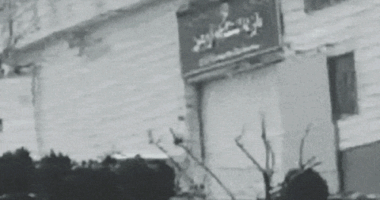 The gate of Evin Prison in Iran is blown open.