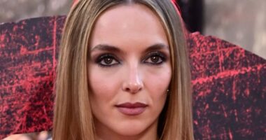 Jodie Comer puts on a showstopping display in a metallic silver gown as she joins co-star Aaron Taylor-Johnson at the premiere of Danny Boyle's long-awaited sequel 28 Years Later