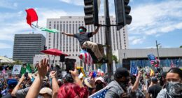 Man arrested after 'intentionally' driving into crowd of protesters at 'No Kings Day' rally in Virginia