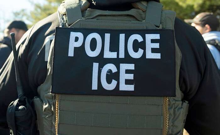 Migrants and ICE officers contend with heat, smog and illness after detoured South Sudan flight