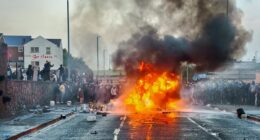 Missiles launched at police as 100s take to the streets of Northern Ireland for a second night after 'Romanian' teenagers appeared in court over alleged attempted rape - as cops make third arrest