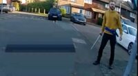 Moment 'killer' attacks police officers with samurai sword as they try to arrest him after schoolboy was slashed to death in street