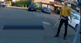 Moment 'killer' attacks police officers with samurai sword as they try to arrest him after schoolboy was slashed to death in street