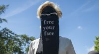 Moment crowd of women's rights campaigners dressed in Niqab-style veils ripped them off to declare 'free your face' in provocative London protest