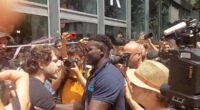 Moment furious hotel worker fights back against crowd of anti-tourism protesters as they seal off his business in Barcelona and bombard it with water guns and smoke canisters