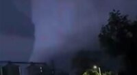 Moment huge wedge tornado with terrifying black funnel rips path of destruction in deadly electric storms killing three