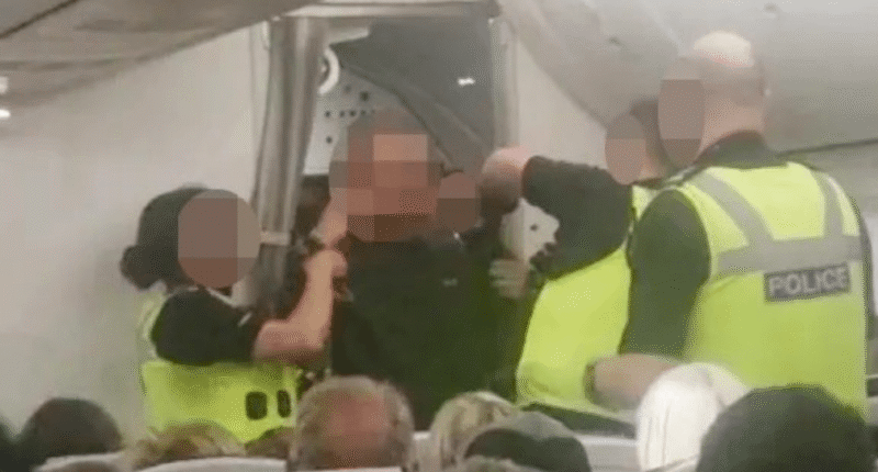 Moment ‘drunk’ passenger hauled off TUI flight by cops after PUNCHING cabin crew & screaming ‘plane’s going to crash’