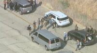 Protest at Dodger Stadium gets underway as immigration agents seen nearby amid reports of more ICE raids in LA County