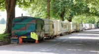 Residents fight back against caravan city: Van dwellers complain about 'NIMBYs' who blare their horns, kick their caravans and throw stones to scare them away