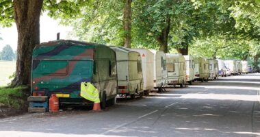 Residents fight back against caravan city: Van dwellers complain about 'NIMBYs' who blare their horns, kick their caravans and throw stones to scare them away