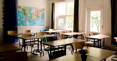 School nurse off the job after ‘wearing ICE jacket during Superhero Day’ as parents blast ‘utterly disgusting’ behavior