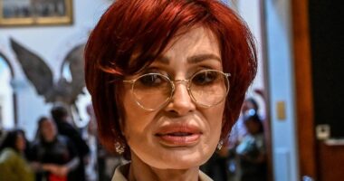 Sharon Osbourne, 72, shows off her plump pout as she attends husband Ozzy's Working Class Hero exhibition at Birmingham's Museum & Art Gallery