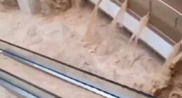 Shock moment floods swamp shopping centre turning escalators into waterfalls & washing cars into underground garages