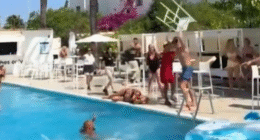 Shocking moment female tourist is bashed in the head with a CHAIR while another topples into pool in Ibiza hotel brawl