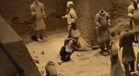 Shocking moment tourist jumps into Terracotta Army clay warriors and damages statues before being overpowered by security guards