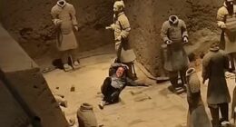 Shocking moment tourist jumps into Terracotta Army clay warriors and damages statues before being overpowered by security guards
