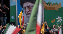 Supreme Leader Ayatollah Ali Khamenei image on the wall during a pro-Iran demonstration