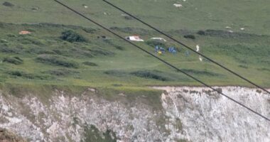 Two dead after car plunges 300ft off cliff at beauty spot 'as horrified holidaymakers watched on'