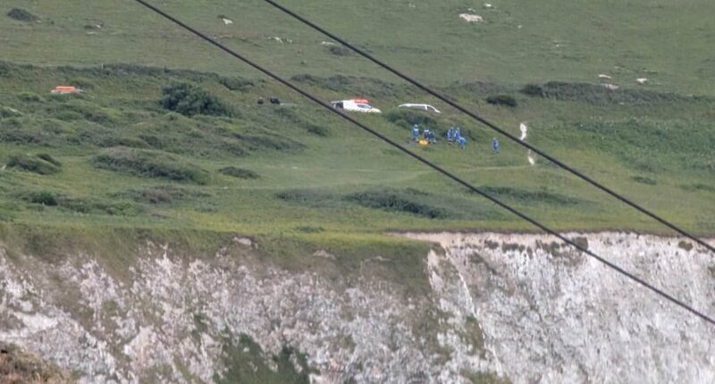 Two dead after car plunges 300ft off cliff at beauty spot 'as horrified holidaymakers watched on'