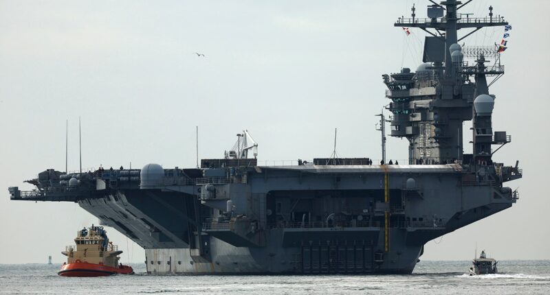 USS Nimitz carrier strike group sailing toward Middle East ahead of schedule, US official says