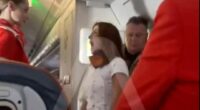 Wild moment furious female plane passenger has mid-air meltdown demanding business class upgrade