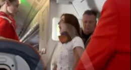 Wild moment furious female plane passenger has mid-air meltdown demanding business class upgrade
