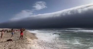 The moment rare 'roll clouds' sweep across Portugal during record heatwave - while in Italy a 'water bomb' kills one person as extreme weather hits the continent
